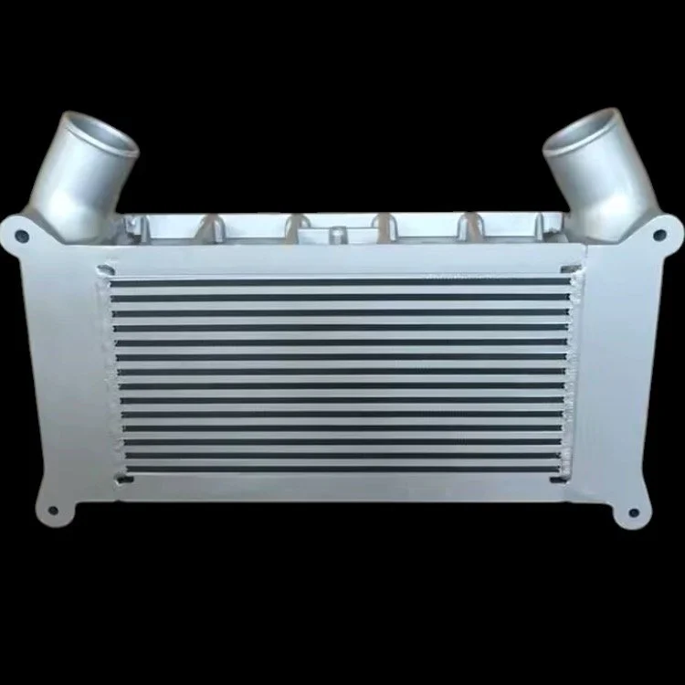 Automotive intercooler with dual inlet/outlet pipes against a black background.