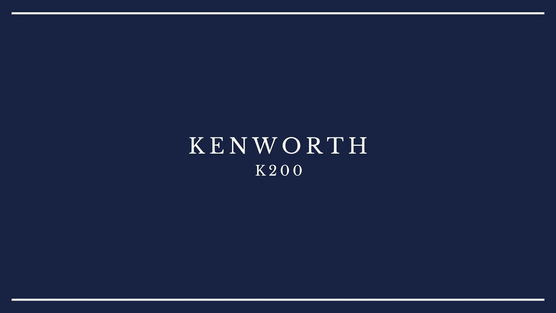 A navy blue card with the text "Kenworth K200" in white lettering, centered on the card with white lines at the top and bottom edges.