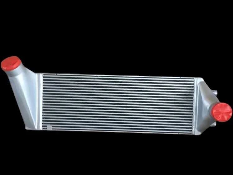 Aluminum car radiator with plastic caps on both ends against a black background.