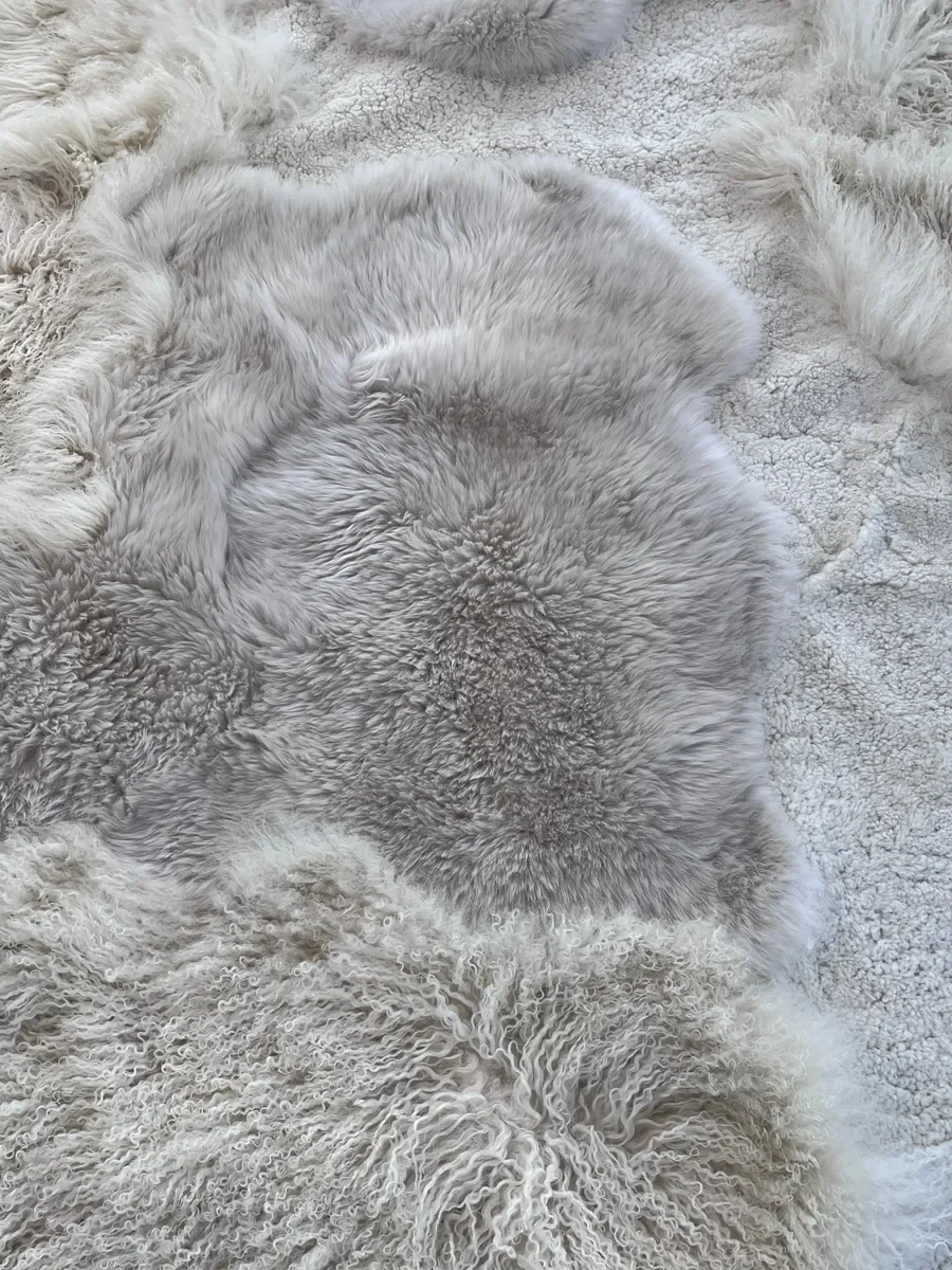 Mango by Wol Society, an ivory sheep skin rug with soft patches of pale dove grey