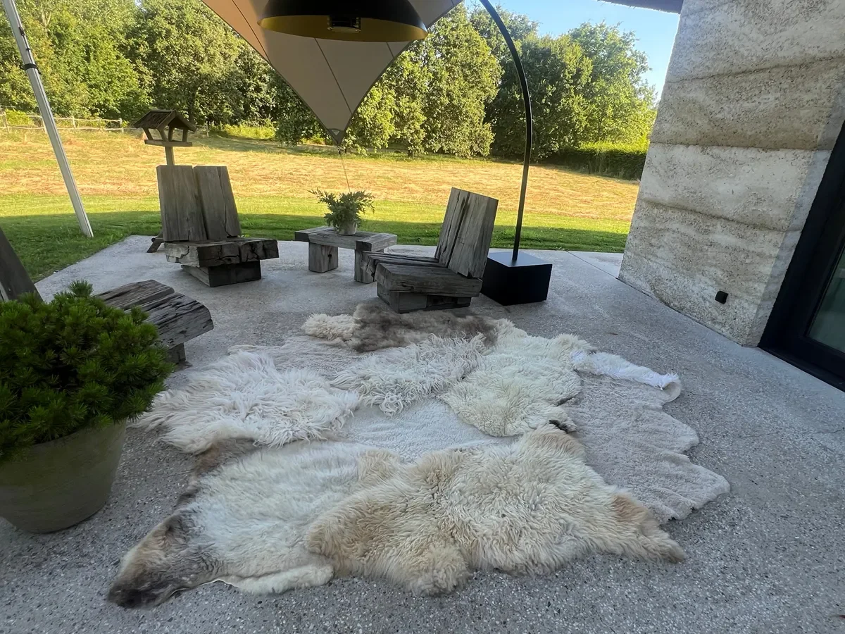 Tilly Moon by Wol Society, an ivory sheep skin rug with taupe pelts, silver grey curls and small brown spots