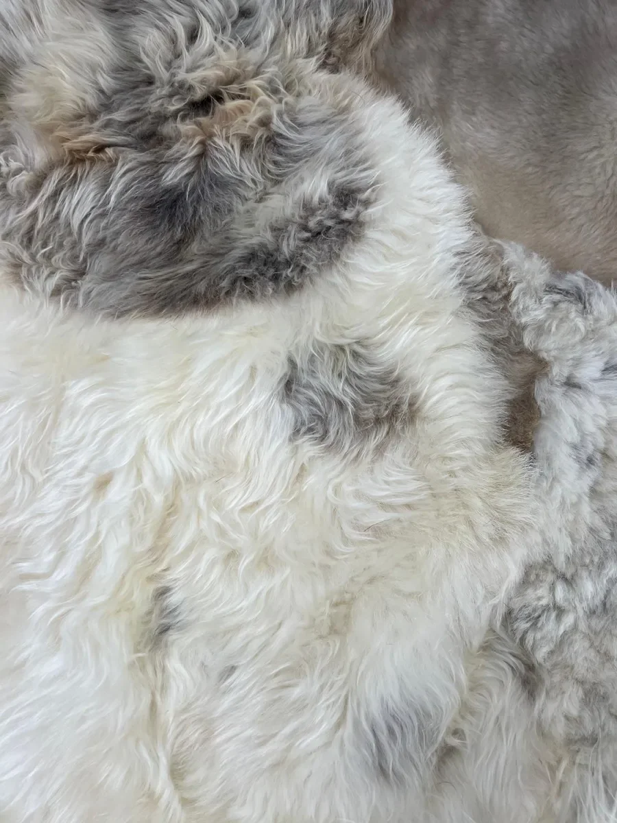 Tilly by Wol Society, a large ivory, grey and taupe patchwork sheepskin rug
