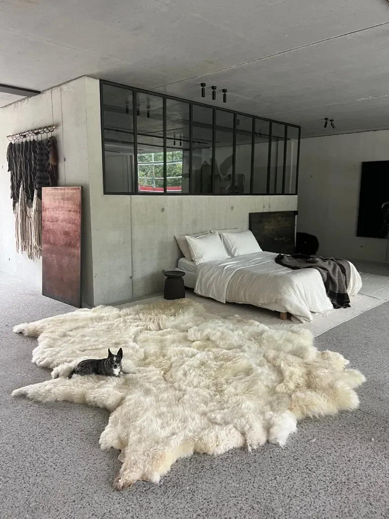 Mieke 205 by Wol Society, a cream sheep skin rug with long, wavy fleece