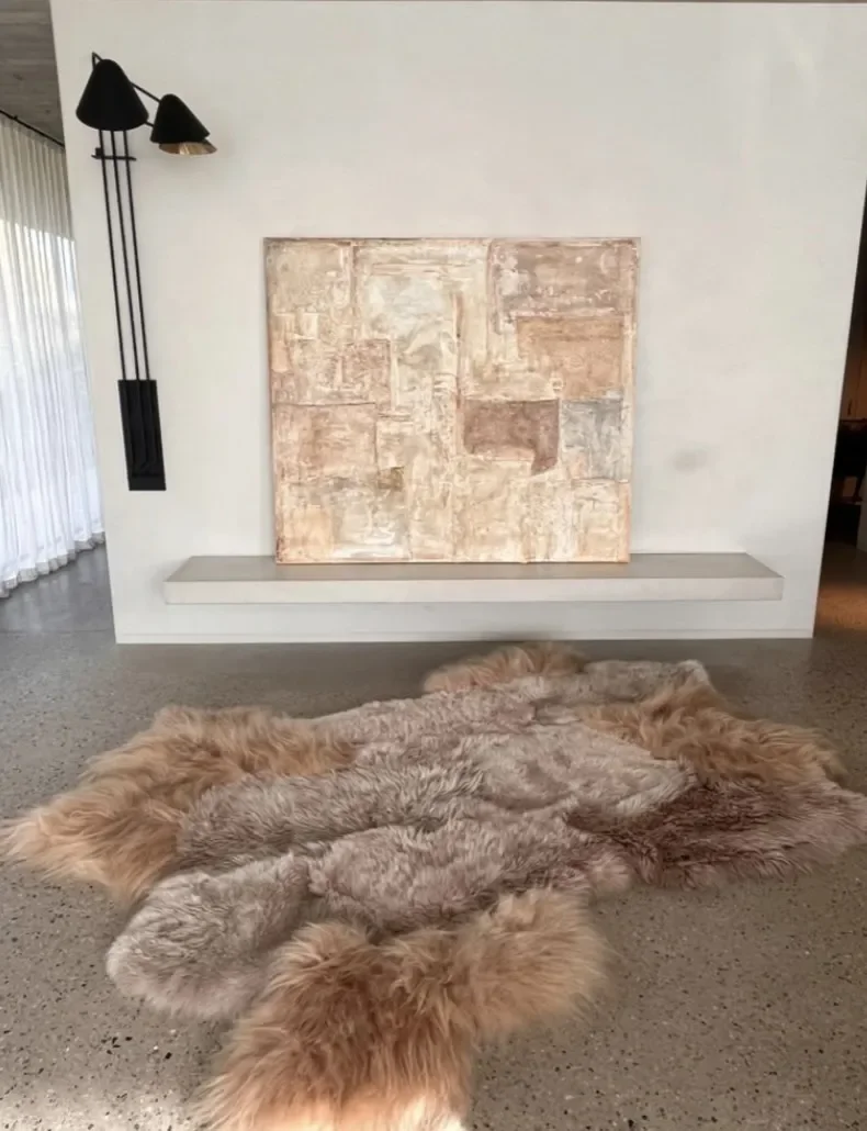 Blush by Wol Society, a dusky taupe sheep skin rug framed by long apricot and honey fleece