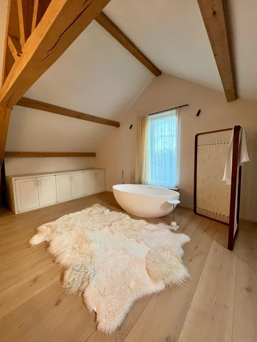 Silence by Wol Society, a buttery ivory sheep skin rug with smooth pelts and long, silky edges