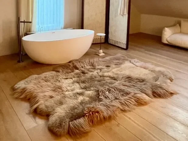 Memories by Wol Society, a taupe and oatmeal sheep skin rug with long, flowing fleece