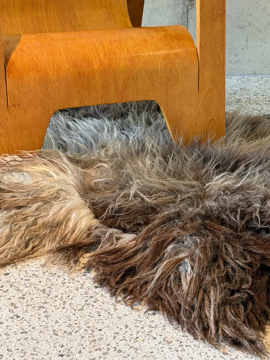 Moonstone by Wol Society, a shaggy smoky brown and grey sheepskin rug with frosted tips