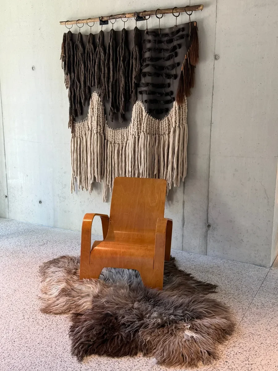 Moonstone by Wol Society, a shaggy smoky brown and grey sheepskin rug with frosted tips