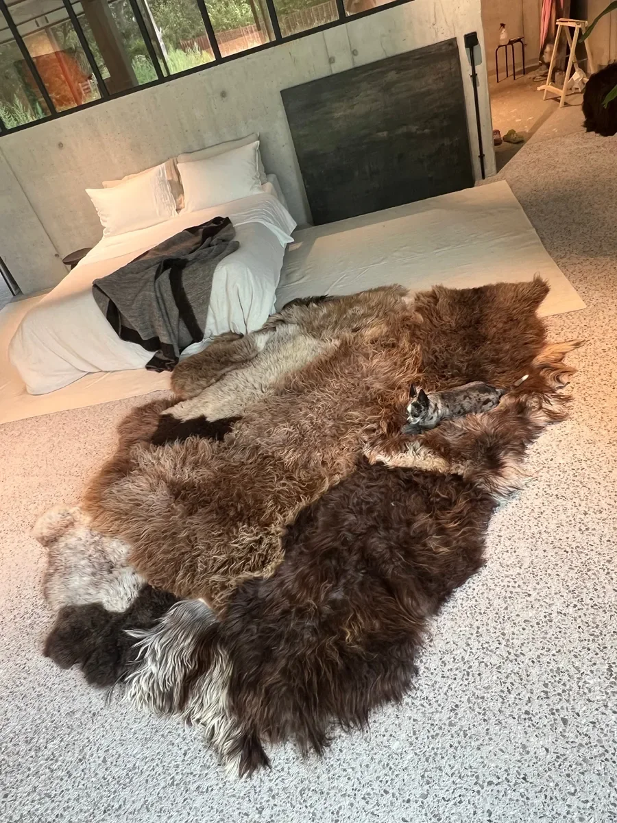 Joep by Wol Society, a brown and grey patchwork sheepskin rug with long, layered fleece