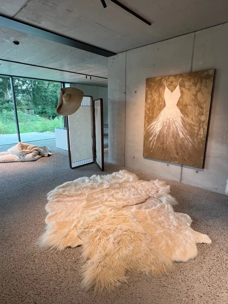 PomPom by Wol Society, a buttery cream sheep skin rug with long, fluffy edges