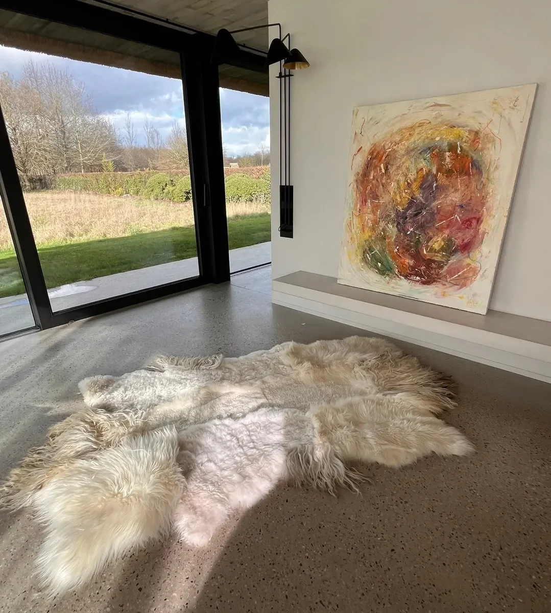 Snow White by Wol Society, a bright white sheepskin rug with long waves and soft curls