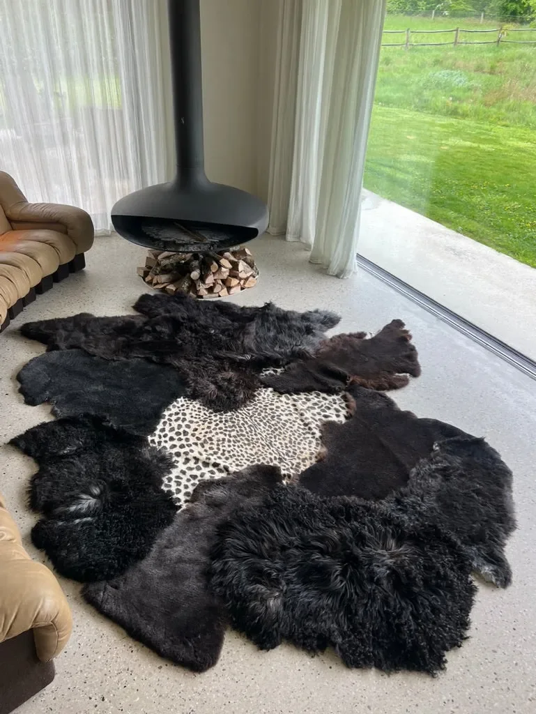Leo by Wol Society, a giant black sheepskin rug with a faux leopard print center