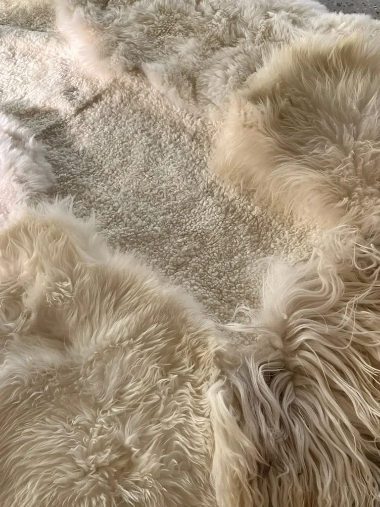 Snow White by Wol Society, a bright white sheepskin rug with long waves and soft curls