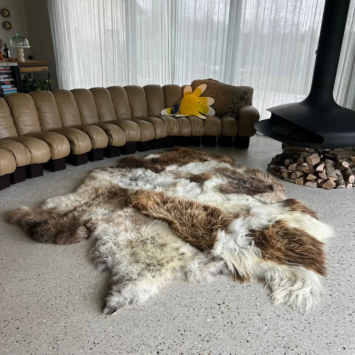 Prince by Wol Society, a large white and brown patchwork sheepskin rug with chestnut and chocolate curls