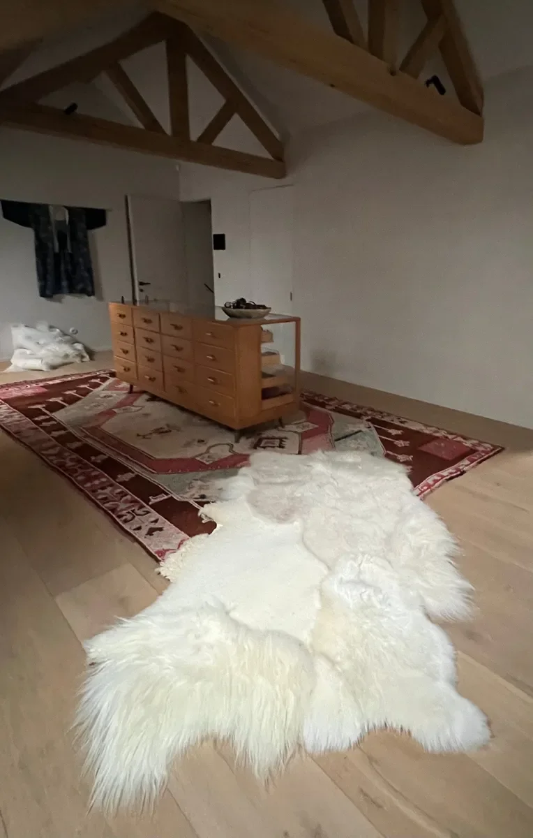 Lewis by Wol Society, an elongated white sheepskin rug with long, fluffy fleece