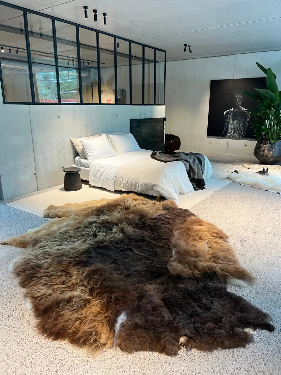 Mieke 203 by Wol Society, a shaggy brown sheepskin rug in chocolate, chestnut and copper