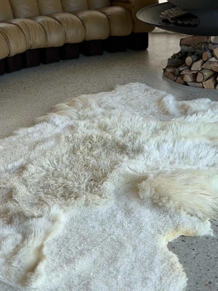 Milky Way by Wol Society, a white and cream sheep skin rug with a curly pale butter center