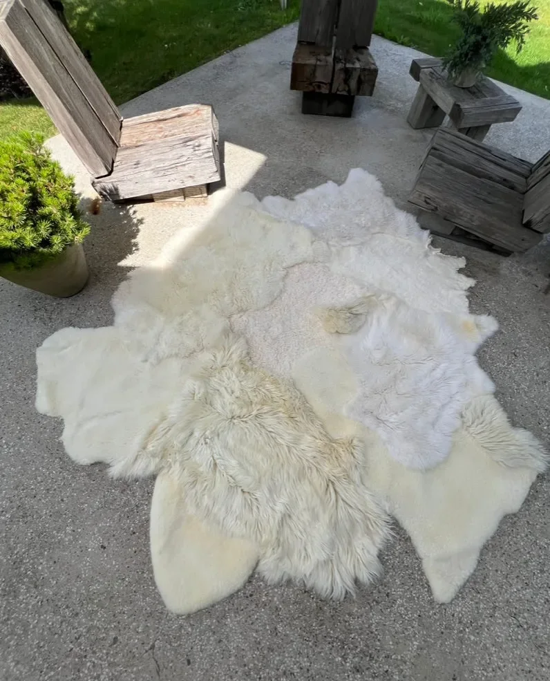 Sjoe by Wol Society, a near-square white sheepskin rug with smooth, curly and fluffy patches
