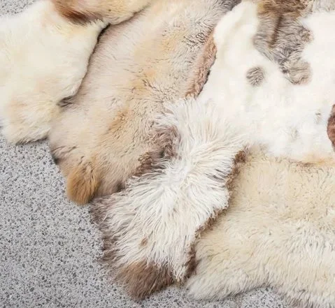 Vanilla by Wol Society, a cream and ivory sheep skin rug with taupe and grey-brown pelts