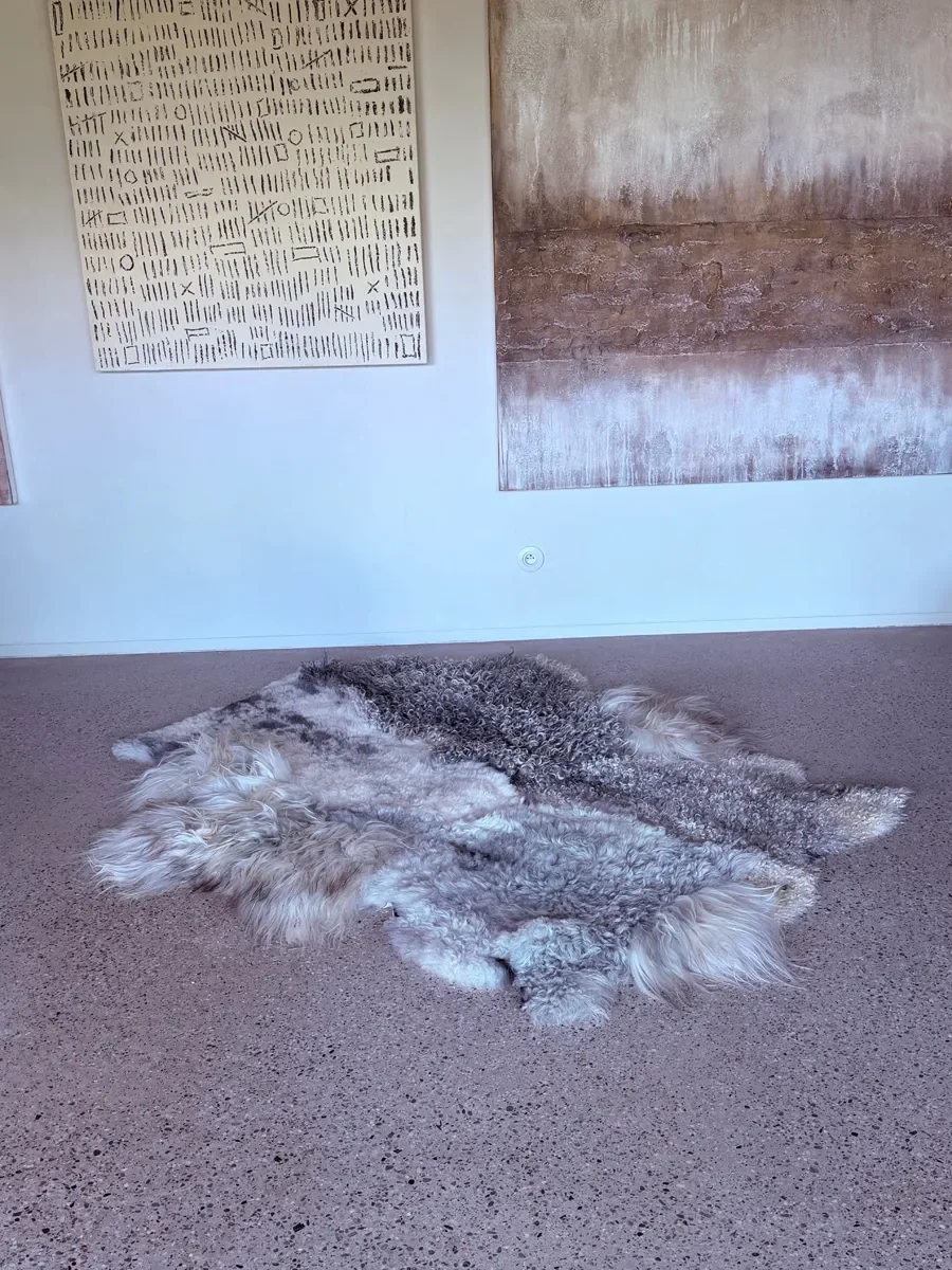 Silver Mist by Wol Society, an ivory and silver grey sheepskin rug with curly, frosted pelts