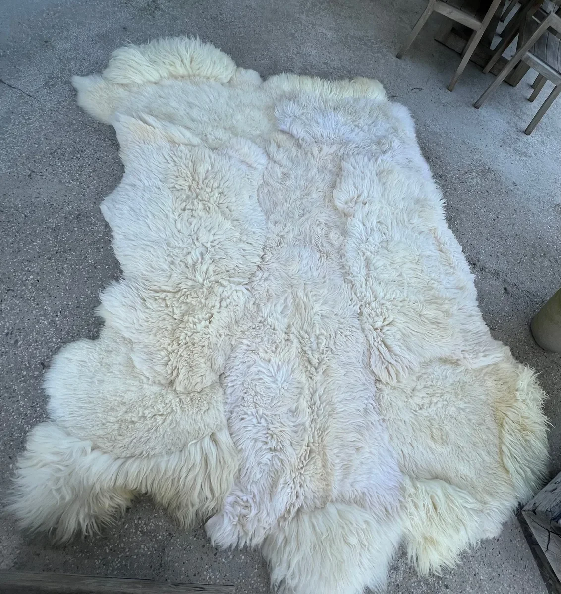 Winnie by Wol Society, a large creamy white sheepskin rug with long, airy fleece