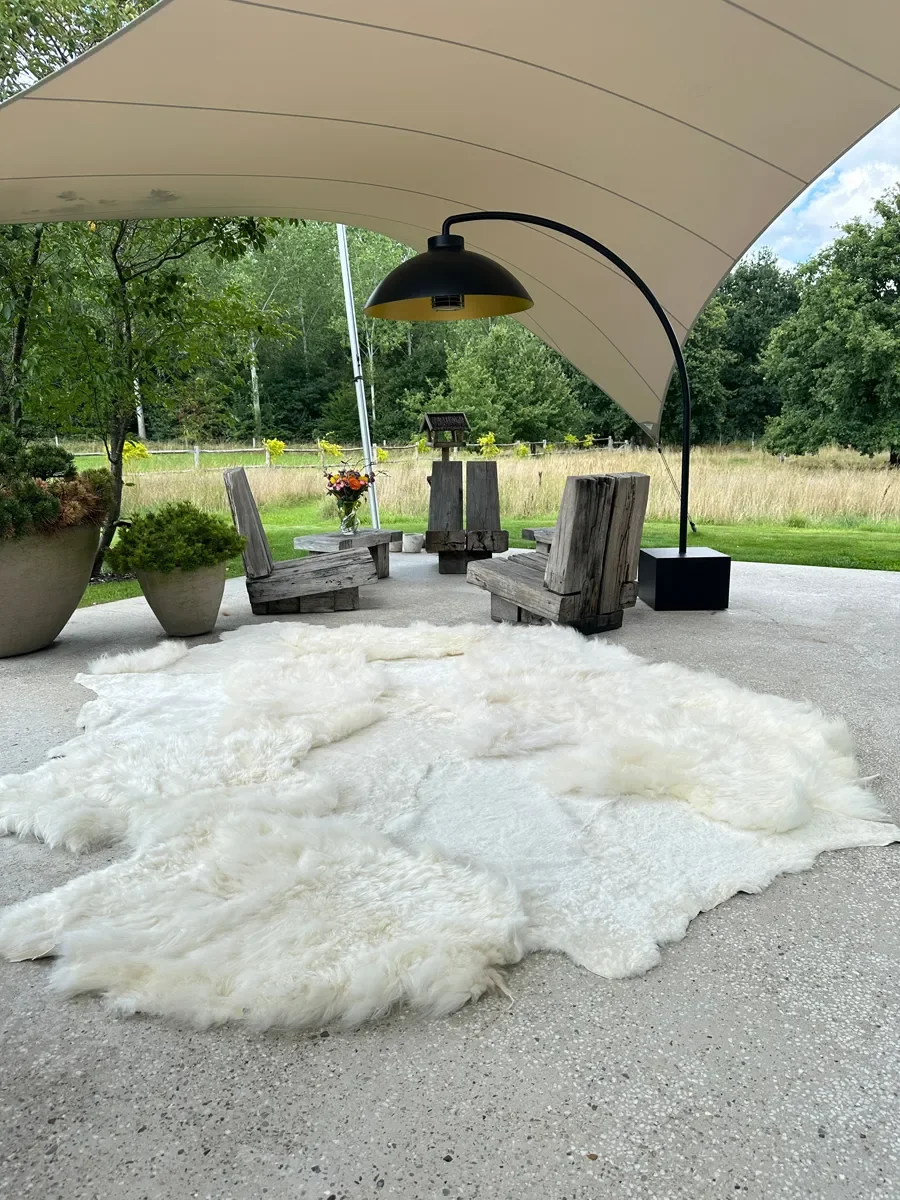 Mieke 189 by Wol Society, a large creamy white sheepskin rug with fluffy and smooth fleece