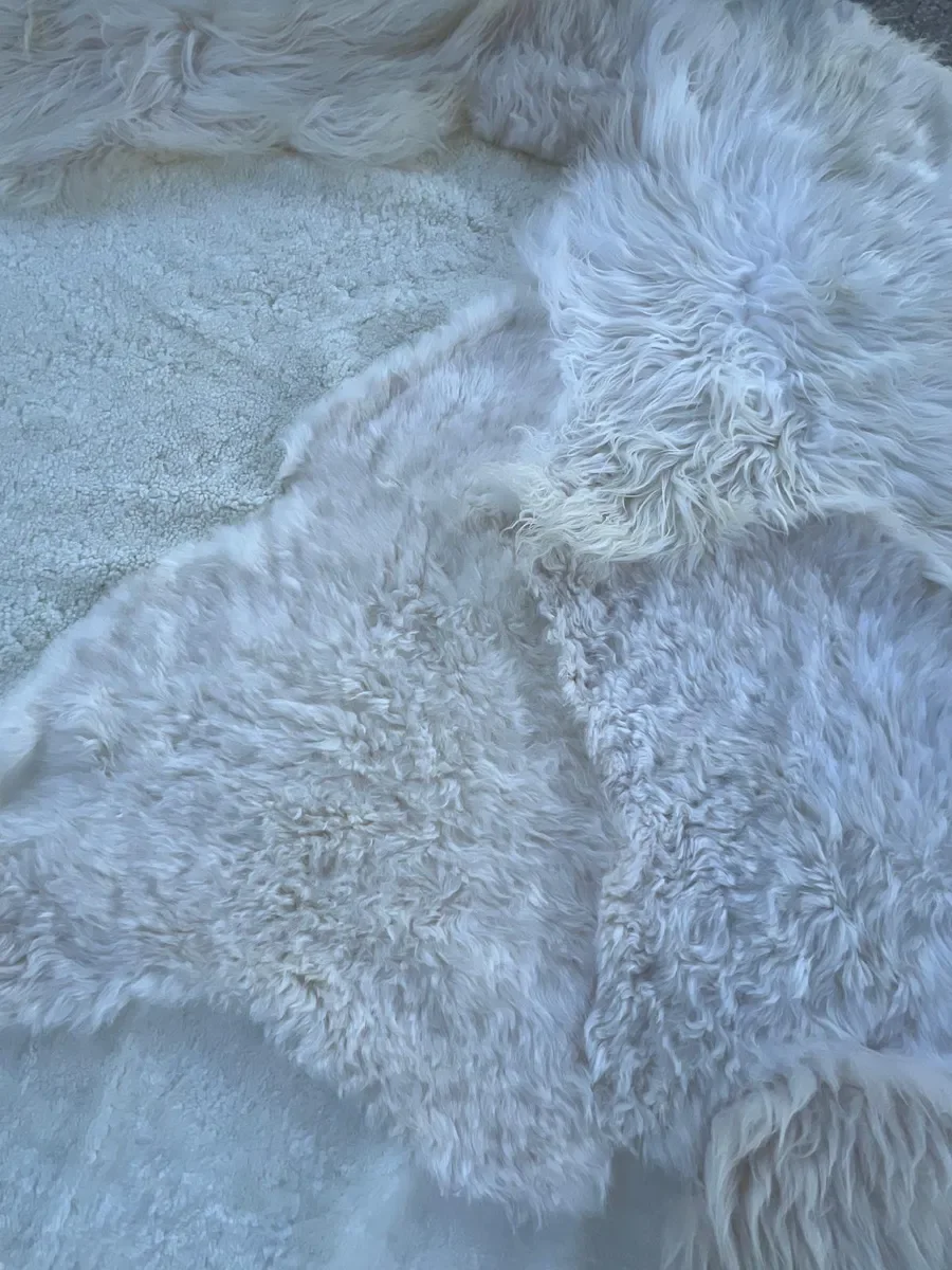 Pipkin by Wol Society, an ivory sheep skin rug with smooth, curly and fluffy textures