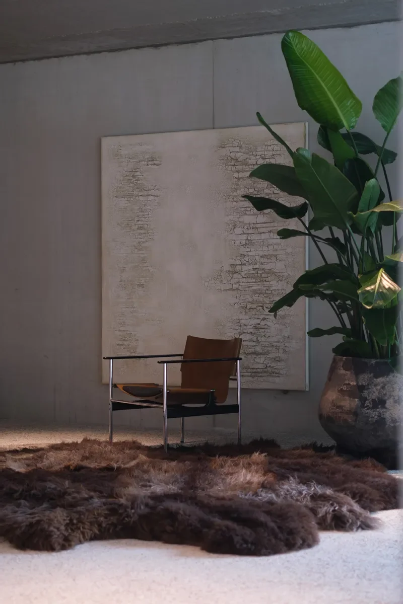 Big Paws by Wol Society, a shaggy, large sheepskin rug in dark chocolate, smoky grey and frosted silver.