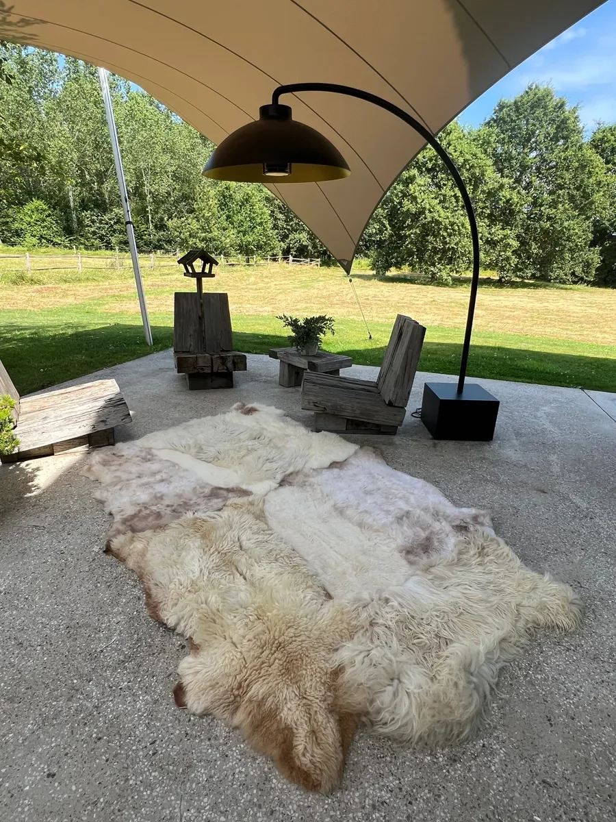 Willowieter by Wol Society, an ivory and cream sheep skin rug mottled with blush and taupe