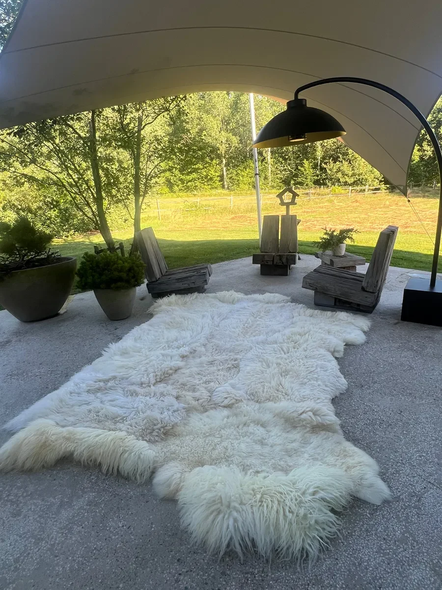 Winnie by Wol Society, a large creamy white sheepskin rug with long, airy fleece