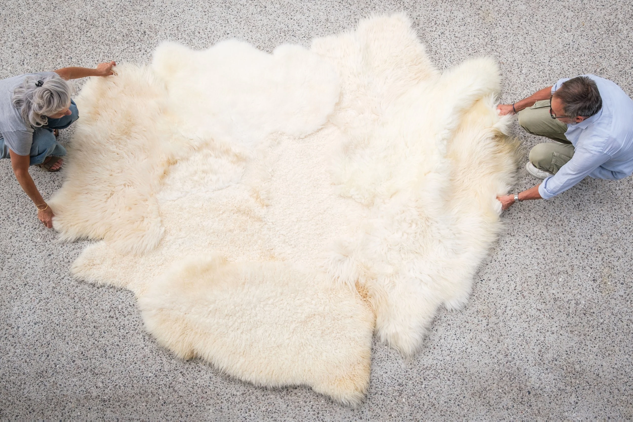 Nugget by Wol Society, a large buttery cream sheep skin rug with curly and silky fleece