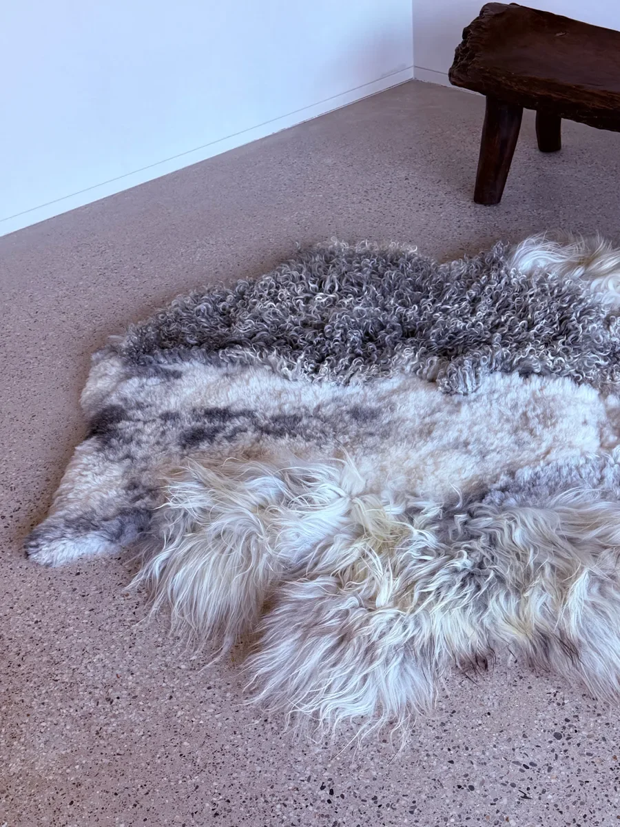 Silver Mist by Wol Society, an ivory and silver grey sheepskin rug with curly, frosted pelts