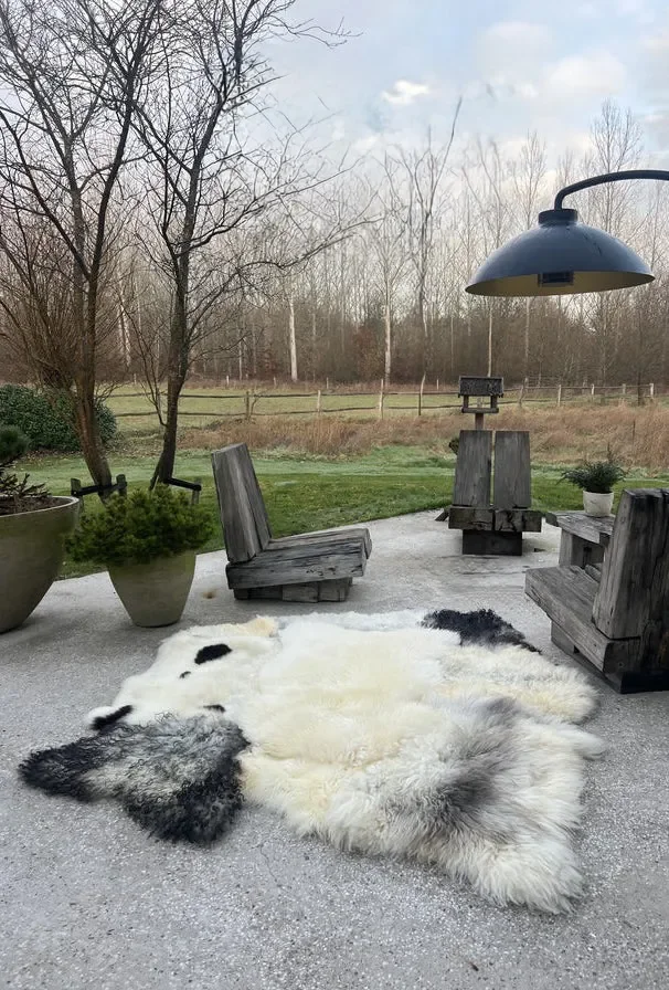 Timmy by Wol Society, a cream sheep skin rug with charcoal and soft grey pelts