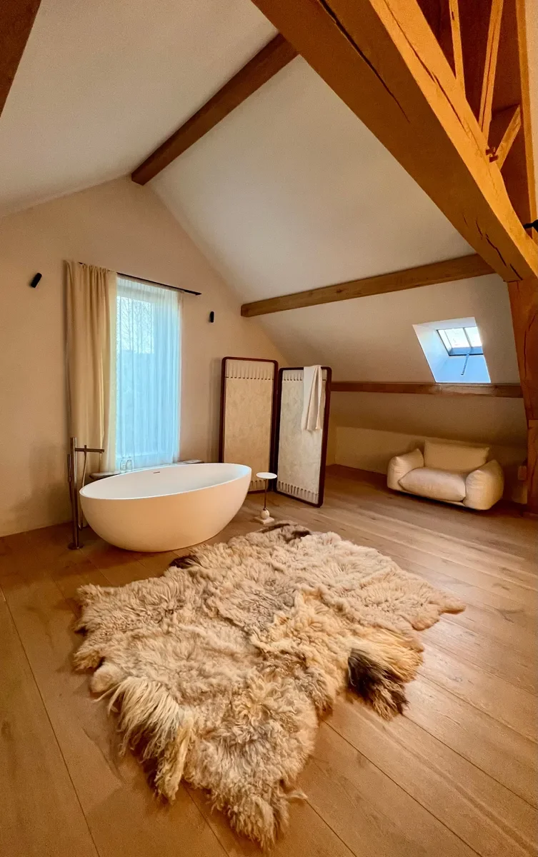 Ivy by Wol Society, a shaggy oatmeal and honey sheep skin rug with darker tips at the edges