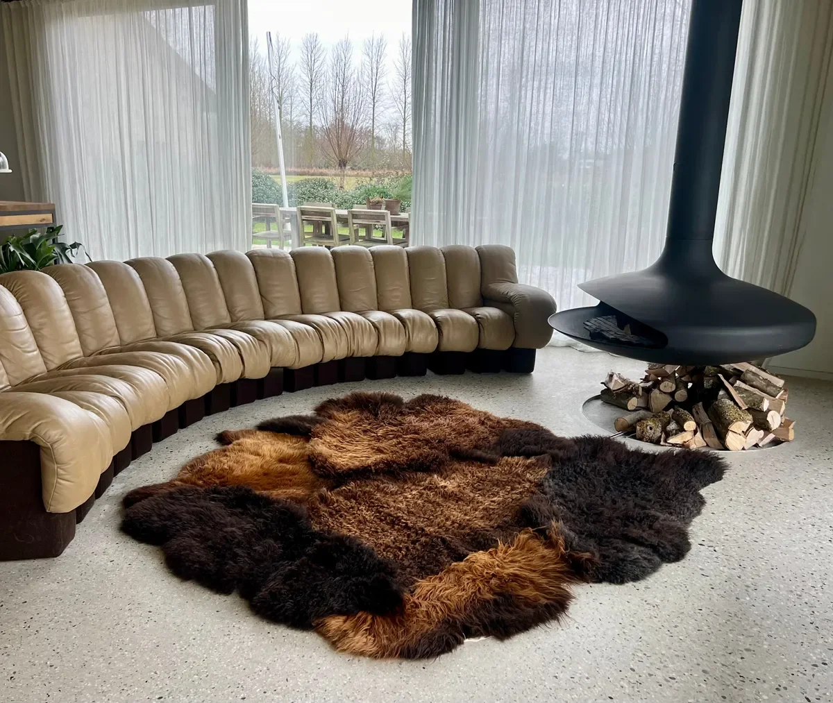 Tosca by Wol Society, a brown sheepskin rug with shaggy espresso and chestnut pelts