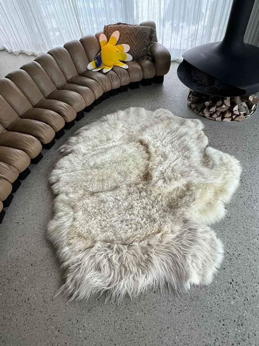 Princess by Wol Society, an ivory sheep skin rug with tight curls and long, silky locks