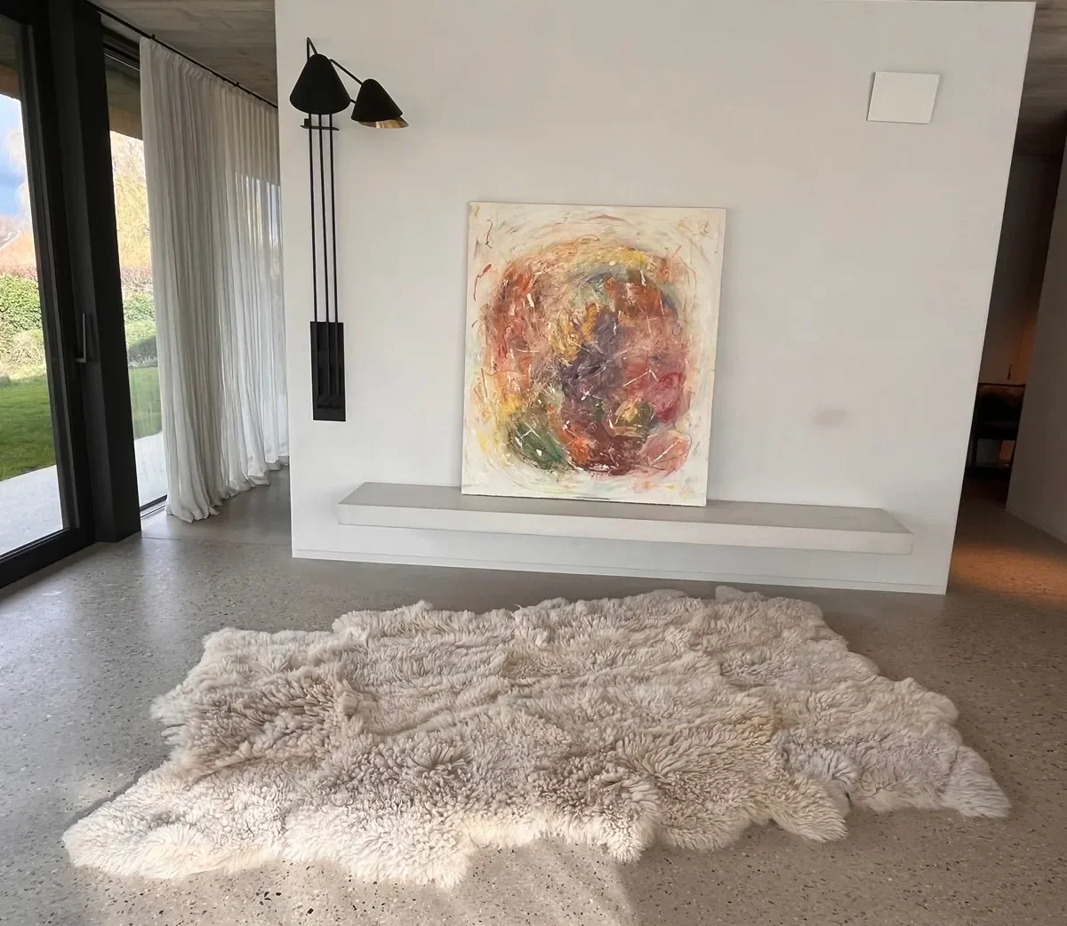 Bubbles by Wol Society, a shaggy cream sheep skin rug with curly, voluminous fleece