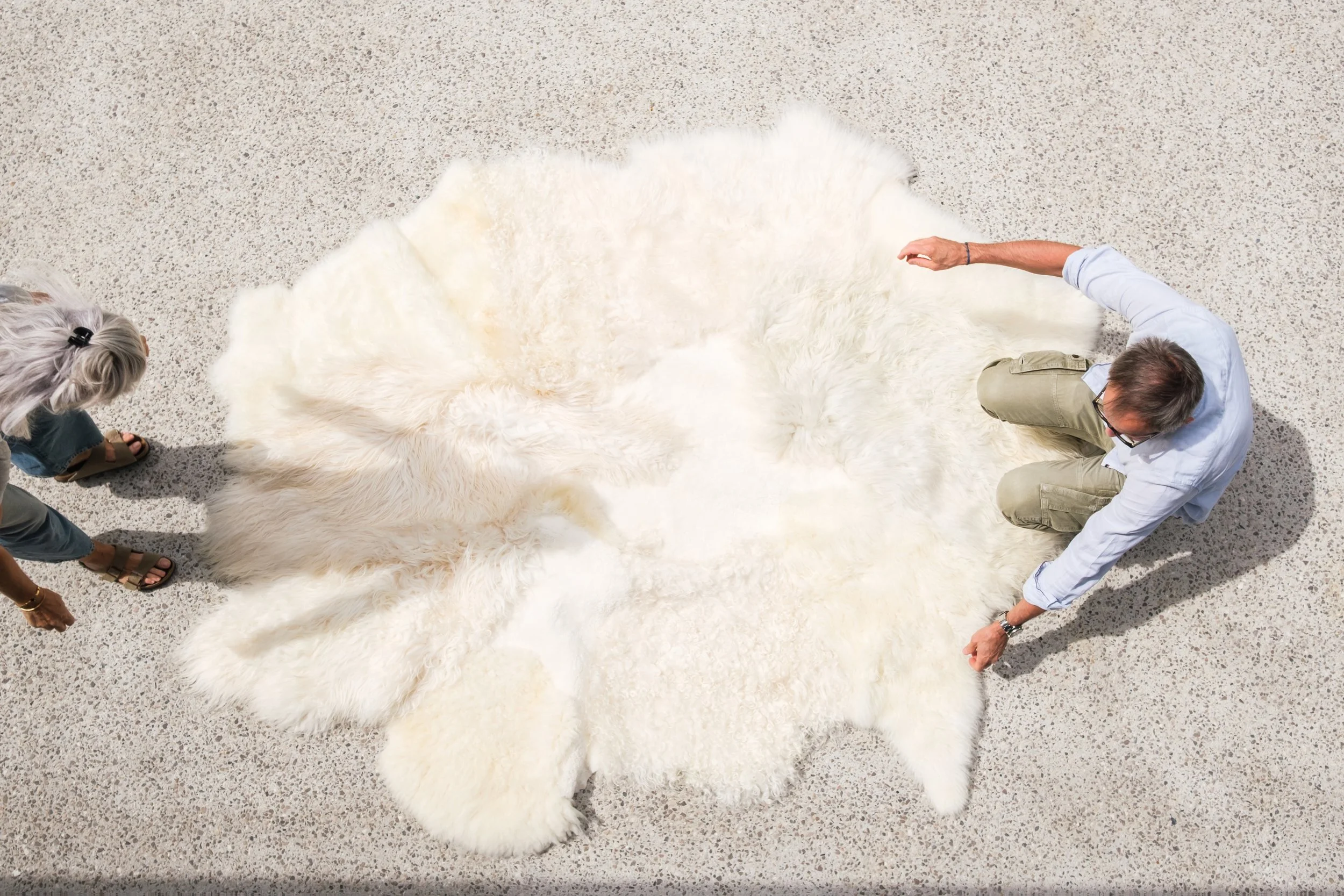 Kai by Wol Society, an ivory and cream sheep skin rug with long, gently wavy fleece