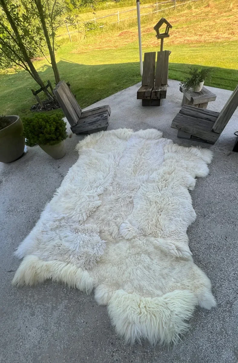 Winnie by Wol Society, a large creamy white sheepskin rug with long, airy fleece