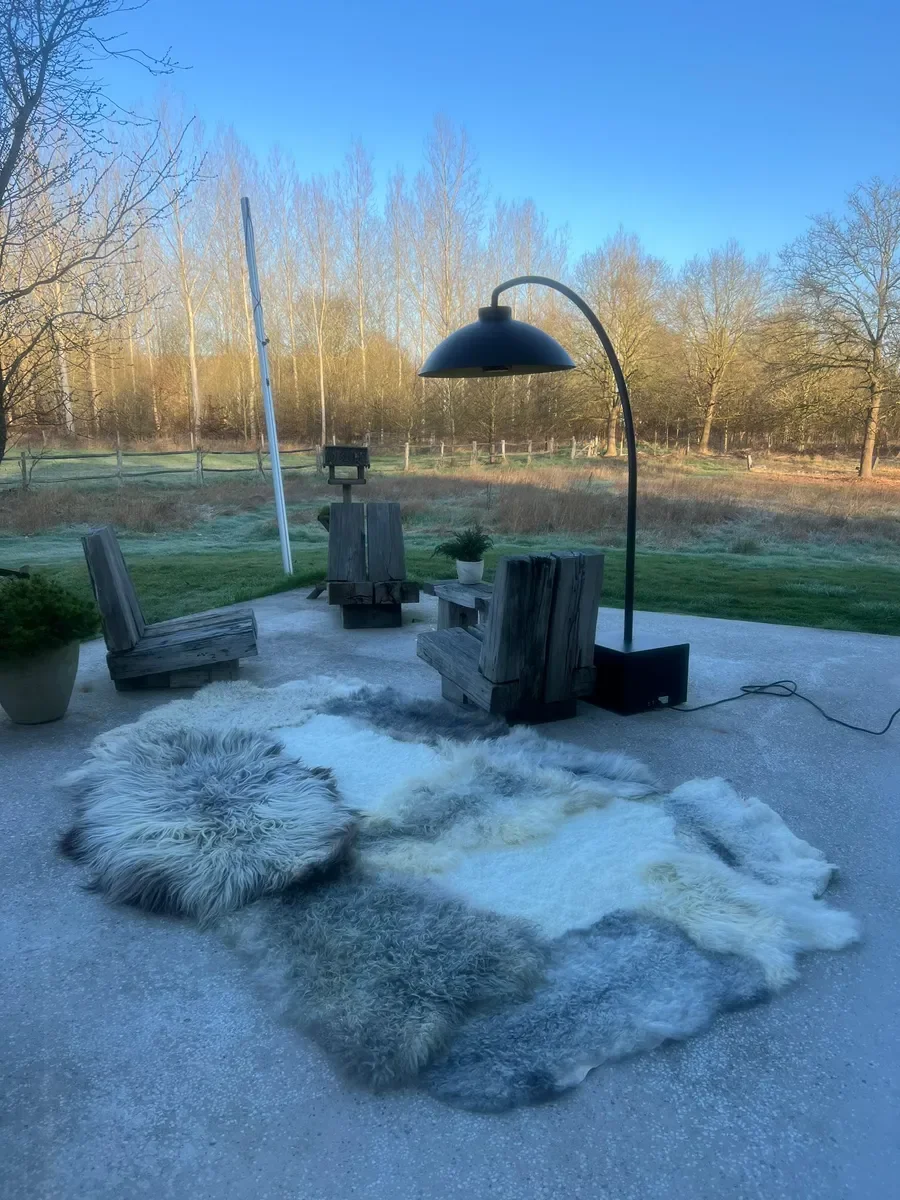 Suus by Wol Society, a large grey sheepskin rug in silver, charcoal and ivory