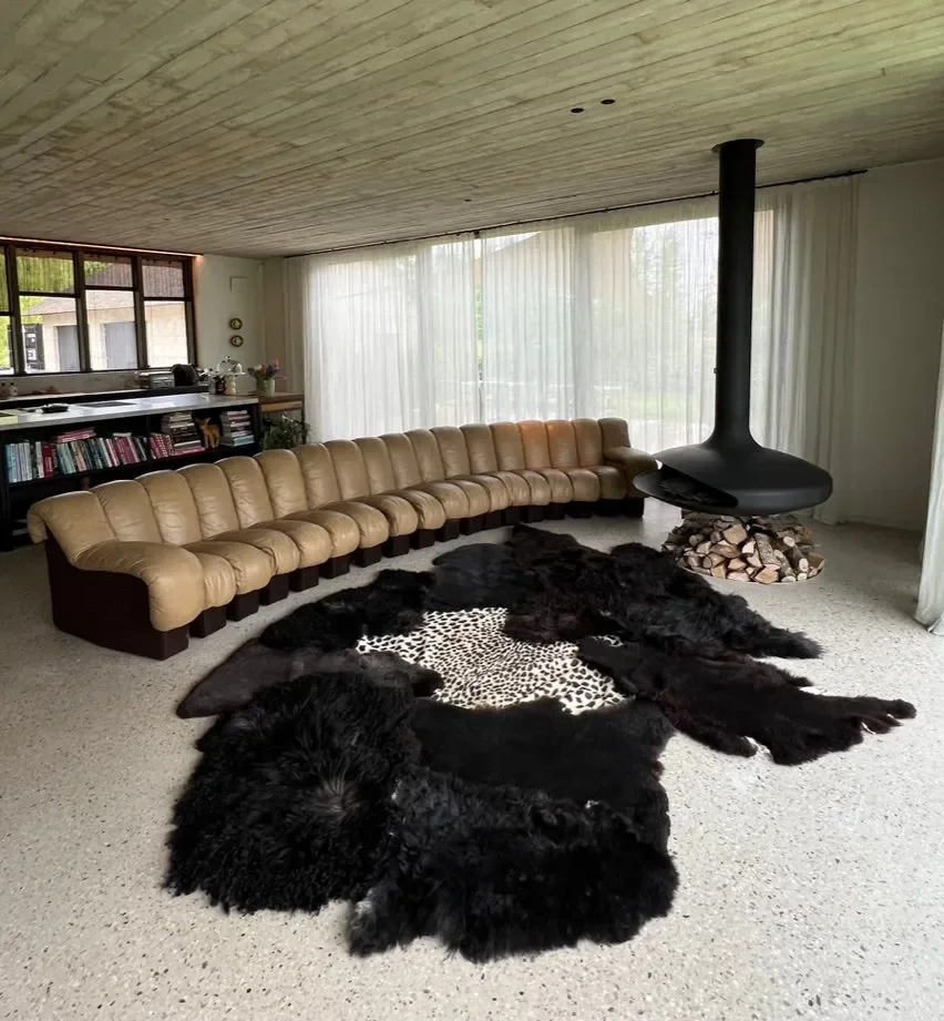 Leo by Wol Society, a giant black sheepskin rug with a faux leopard print center