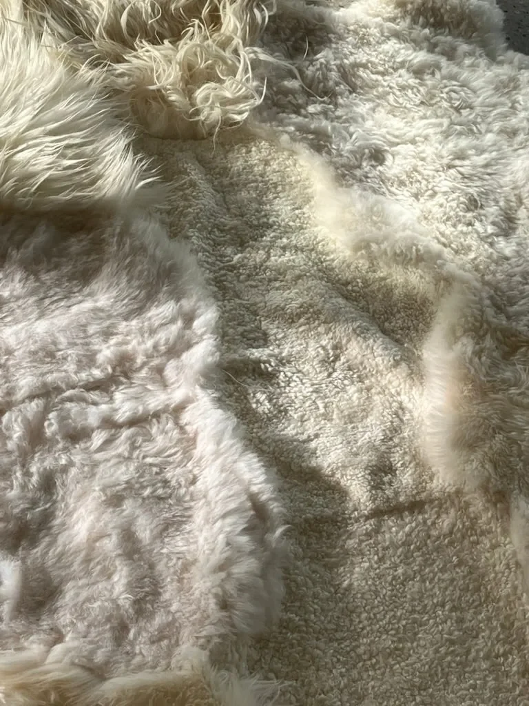 Snow White by Wol Society, a bright white sheepskin rug with long waves and soft curls