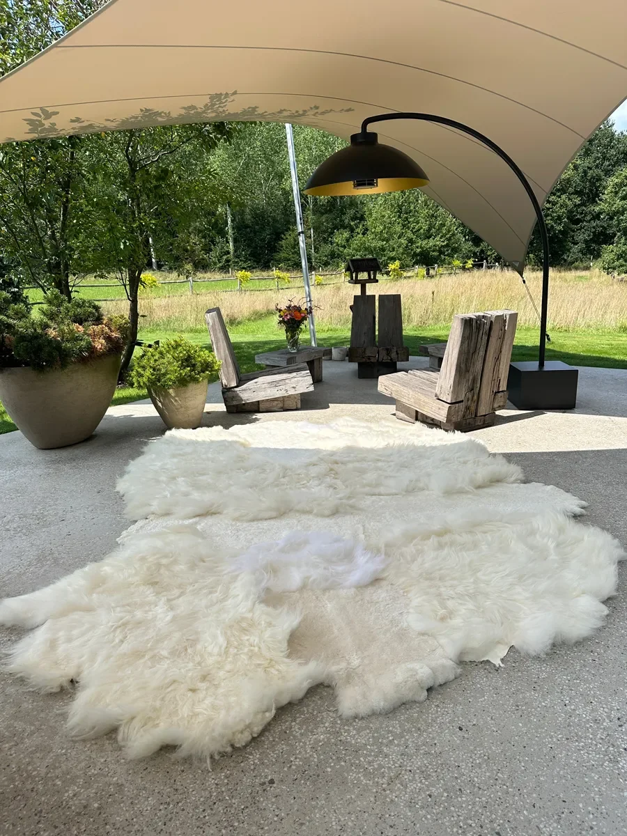 Mieke 193 by Wol Society, a large white sheepskin rug with fluffy fleece from end to end