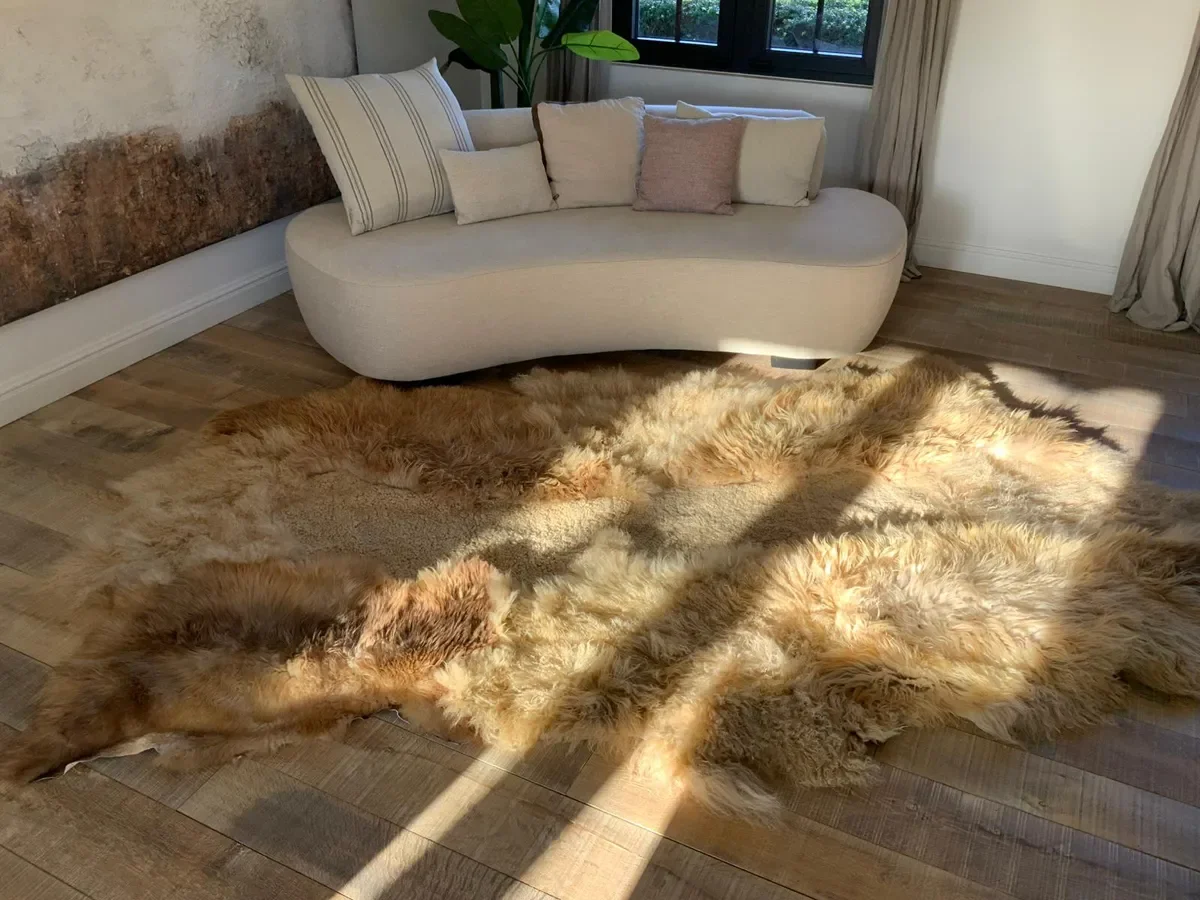 Marcel by Wol Society, a golden sand and caramel sheep skin rug with tousled, silky fleece