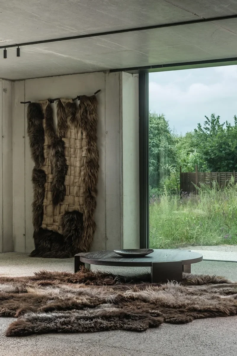 Big Paws by Wol Society, a shaggy, large sheepskin rug in dark chocolate, smoky grey and frosted silver.