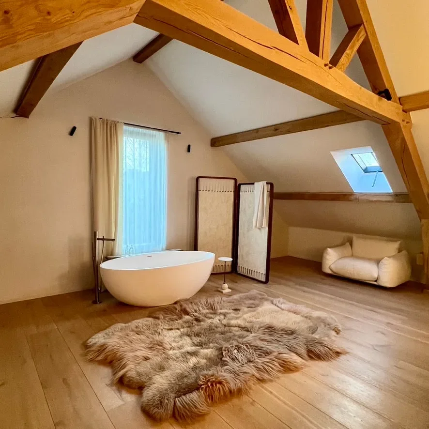 Memories by Wol Society, a taupe and oatmeal sheep skin rug with long, flowing fleece