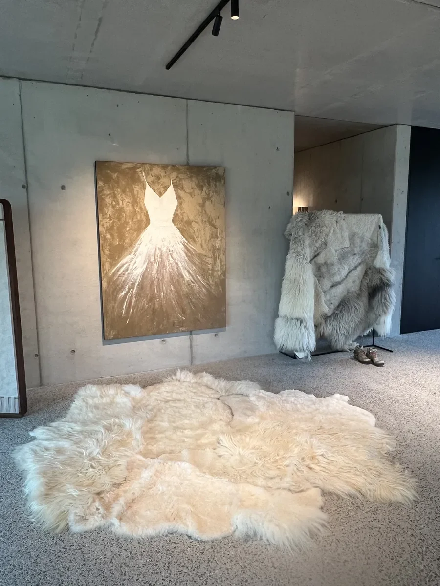 PomPom by Wol Society, a buttery cream sheep skin rug with long, fluffy edges