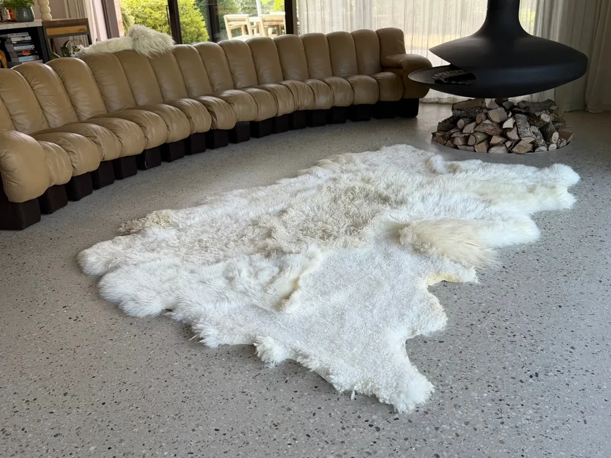 Milky Way by Wol Society, a white and cream sheep skin rug with a curly pale butter center