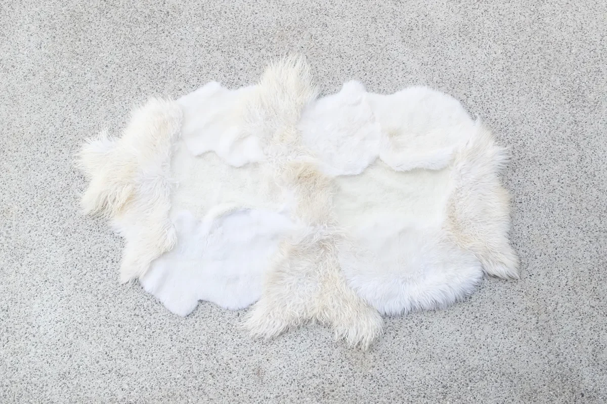 Lulu by Wol Society, a white and ivory sheep skin rug with smooth and fluffy pelts