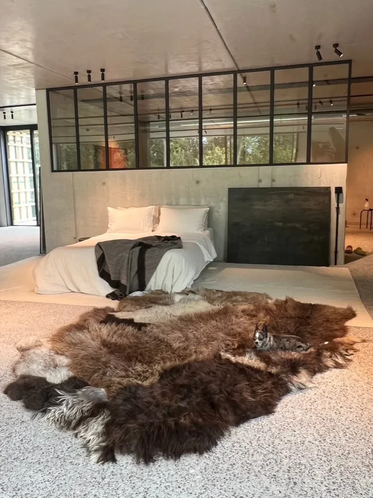 Joep by Wol Society, a brown and grey patchwork sheepskin rug with long, layered fleece